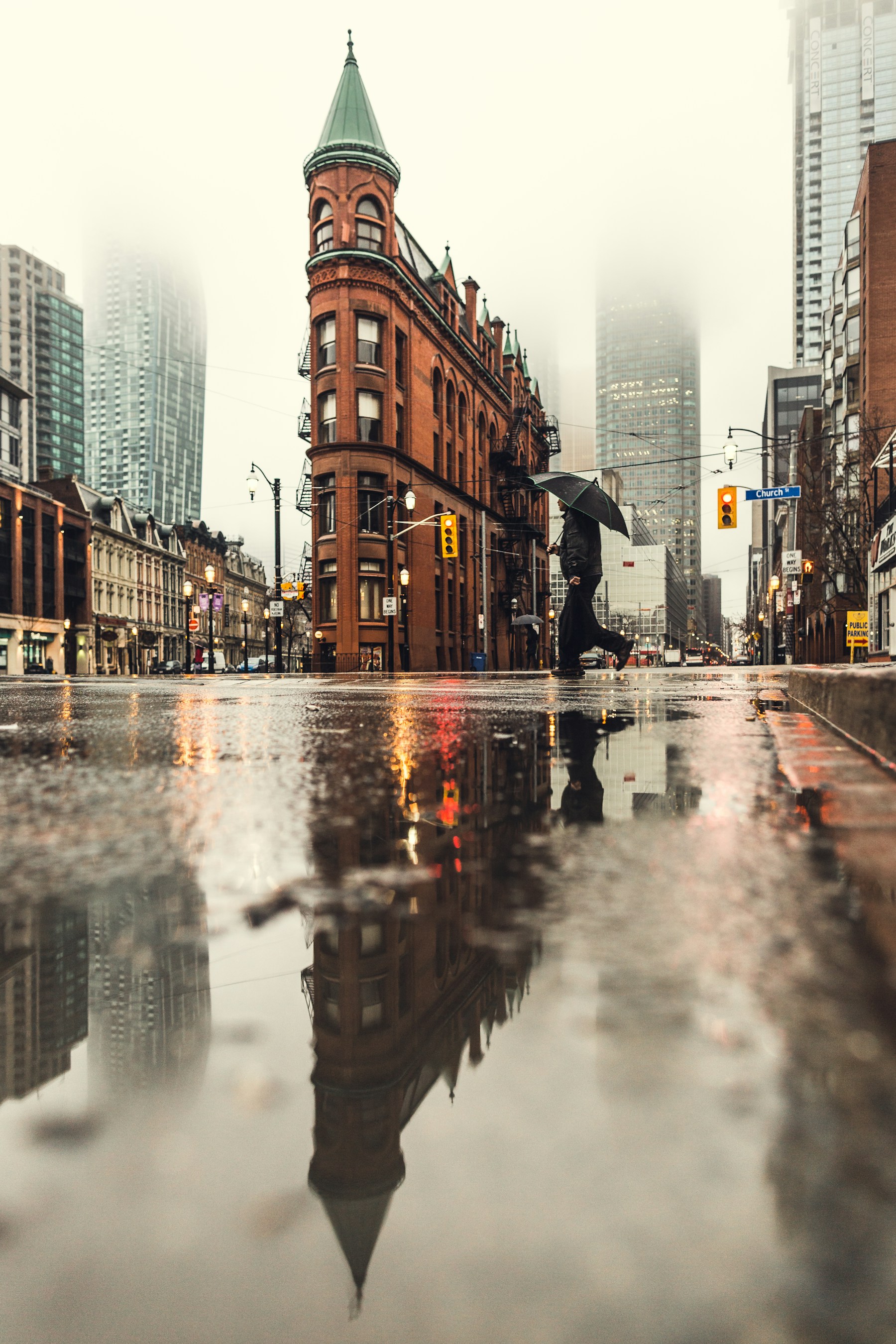 Flatiron building reflected in a rain puddle